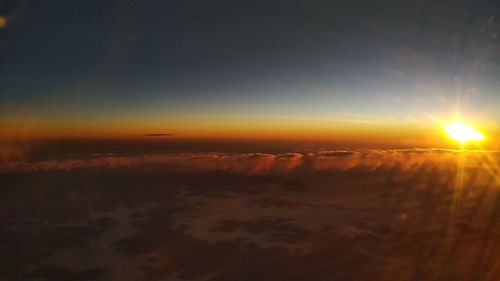 Scenic view of landscape against sky during sunset