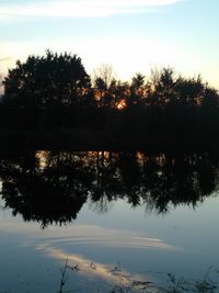 Scenic view of lake at sunset