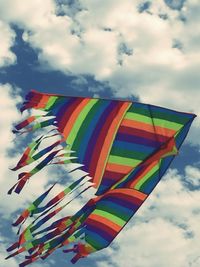 Low angle view of colorful umbrellas against sky