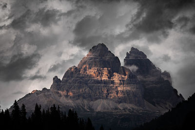 Low angle view of rock formation against sky