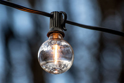 Close-up of illuminated light bulb