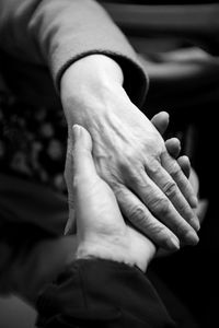 High angle view of friends holding hands