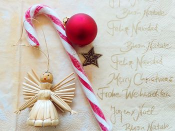 Close-up of christmas decoration with letter on table