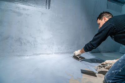 Side view of man working at home