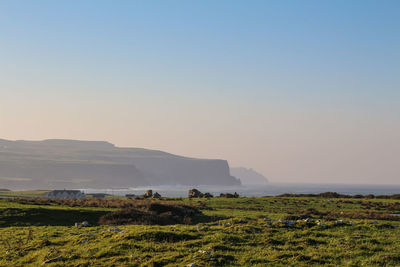 Scenic view of land against clear sky