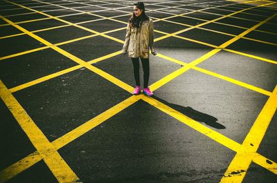 High angle view of person standing on road