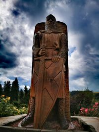 Low angle view of statue against sky