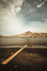 Road by land against sky