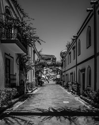 Street amidst buildings against sky