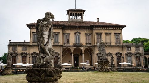 Statue in front of historical building