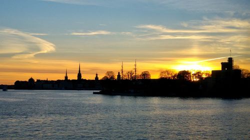 Silhouette of built structure at sunset