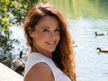 Portrait of a smiling young woman in water