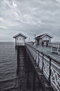 Penarth pier over sea against cloudy sky