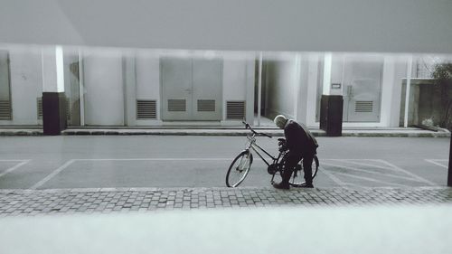 Man riding bicycle in city