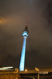 Low angle view of communications tower against sky