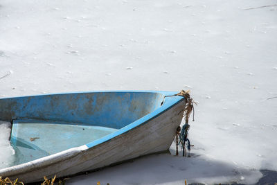 High angle view of abandoned boat moored on beach