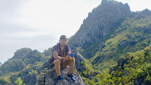 Full length of man standing on mountain