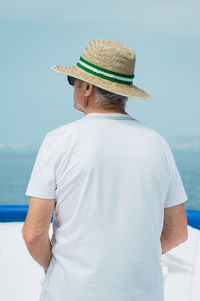 Rear view of man looking at sea