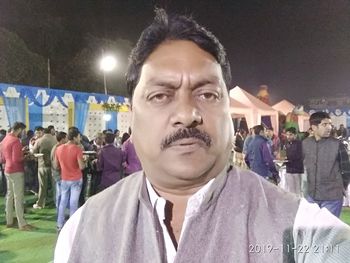 Portrait of young man standing outdoors