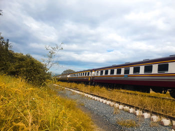 Train on railroad tracks against sky