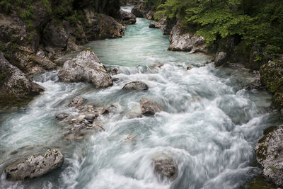 Stream flowing through rocks in sea