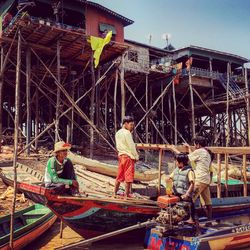 Woman standing by railing