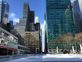 Modern buildings in city against sky