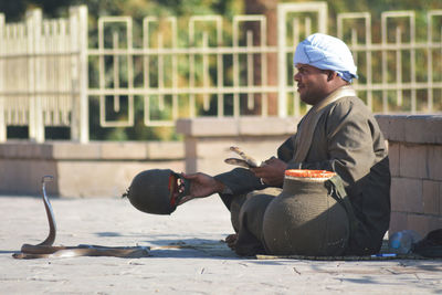 Young man sitting outdoors