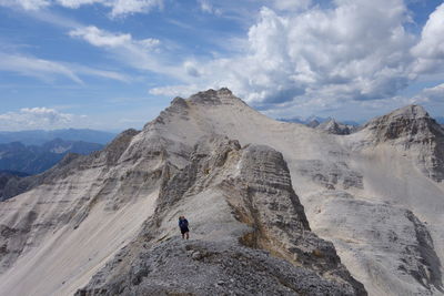 High angle view of person climbing on mountain against cloudy sky at karwendel