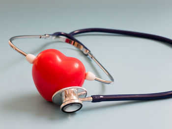 Close-up of red bell on table