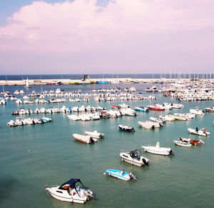 High angle view of boats in sea against sky