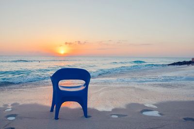 Scenic view of beach against sky during sunset