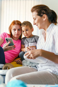 Friends sitting on mobile phone