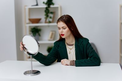 Portrait of young businesswoman working at home