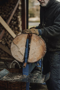 Man sawing log