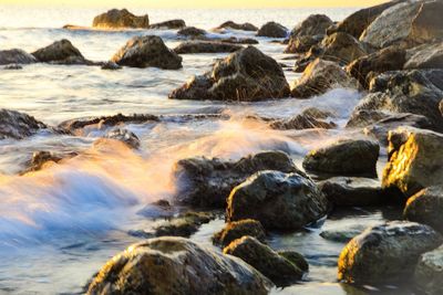 Scenic view of sea at sunset