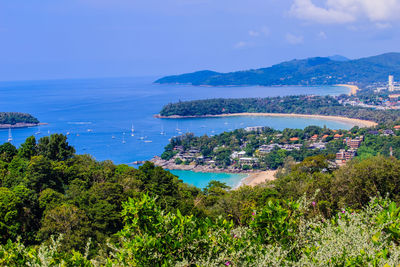 Scenic view of sea and mountains against sky