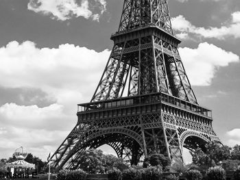 Low angle view of tower against cloudy sky