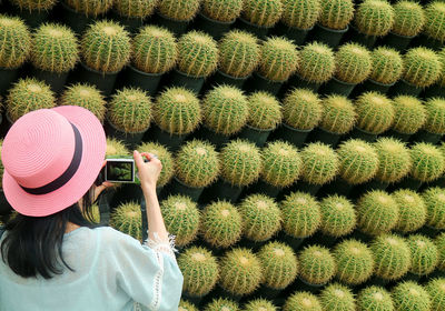 Rear view of woman in pink hat