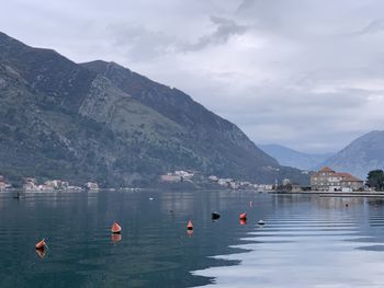 Scenic view of lake and mountains against sky