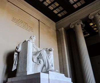 Low angle view of statue against wall