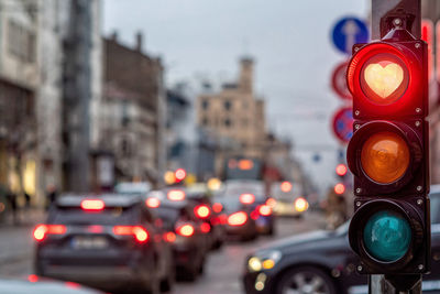 A city crossing with a semaphore, traffic light with red heart-shape in semaphore, valentine day 