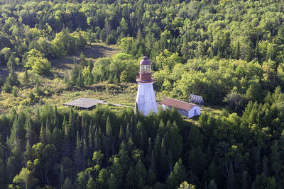 High angle view of traditional windmill amidst trees in forest