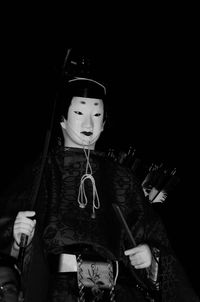 Woman standing at night