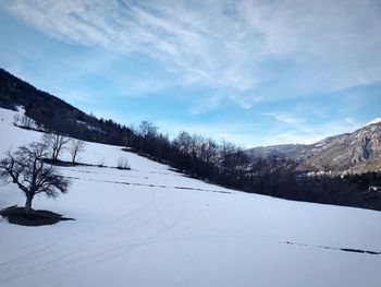 Scenic view of snowcapped mountains against sky