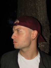 Close-up portrait of young man looking away