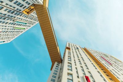 Low angle view of modern buildings against sky