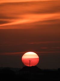 Silhouette landscape against romantic sky at sunset