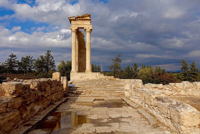 View of old ruins against cloudy sky