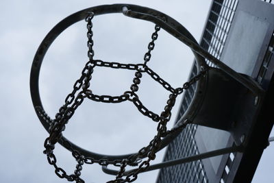 Low angle view of basketball's basket against sky